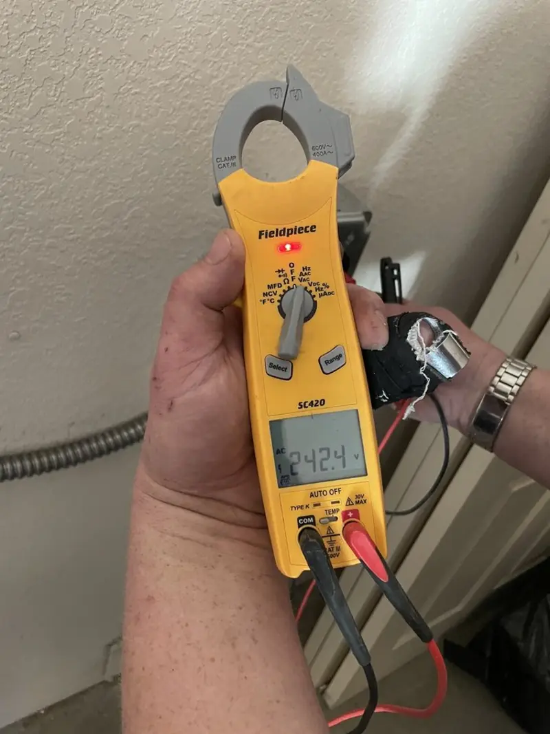 Voltage testing with clamp meter during Ceiling Fan Installation in Franklin